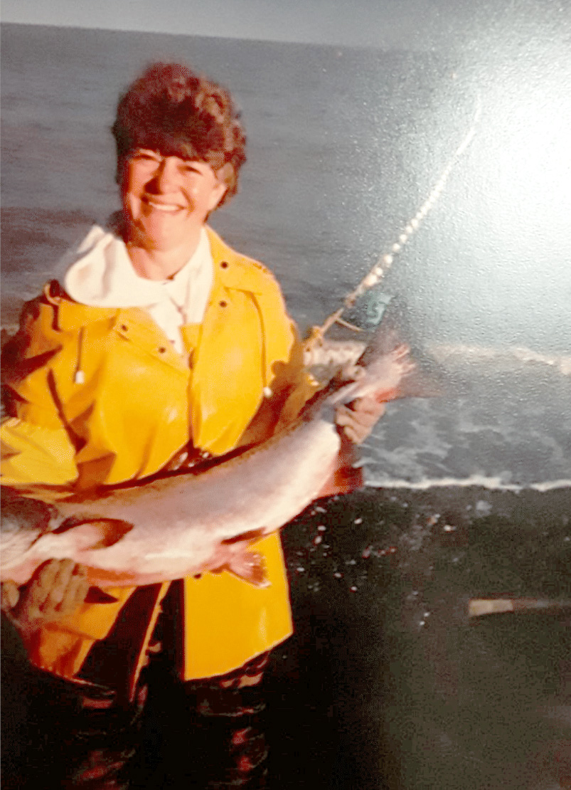 women holding sockeye salmon